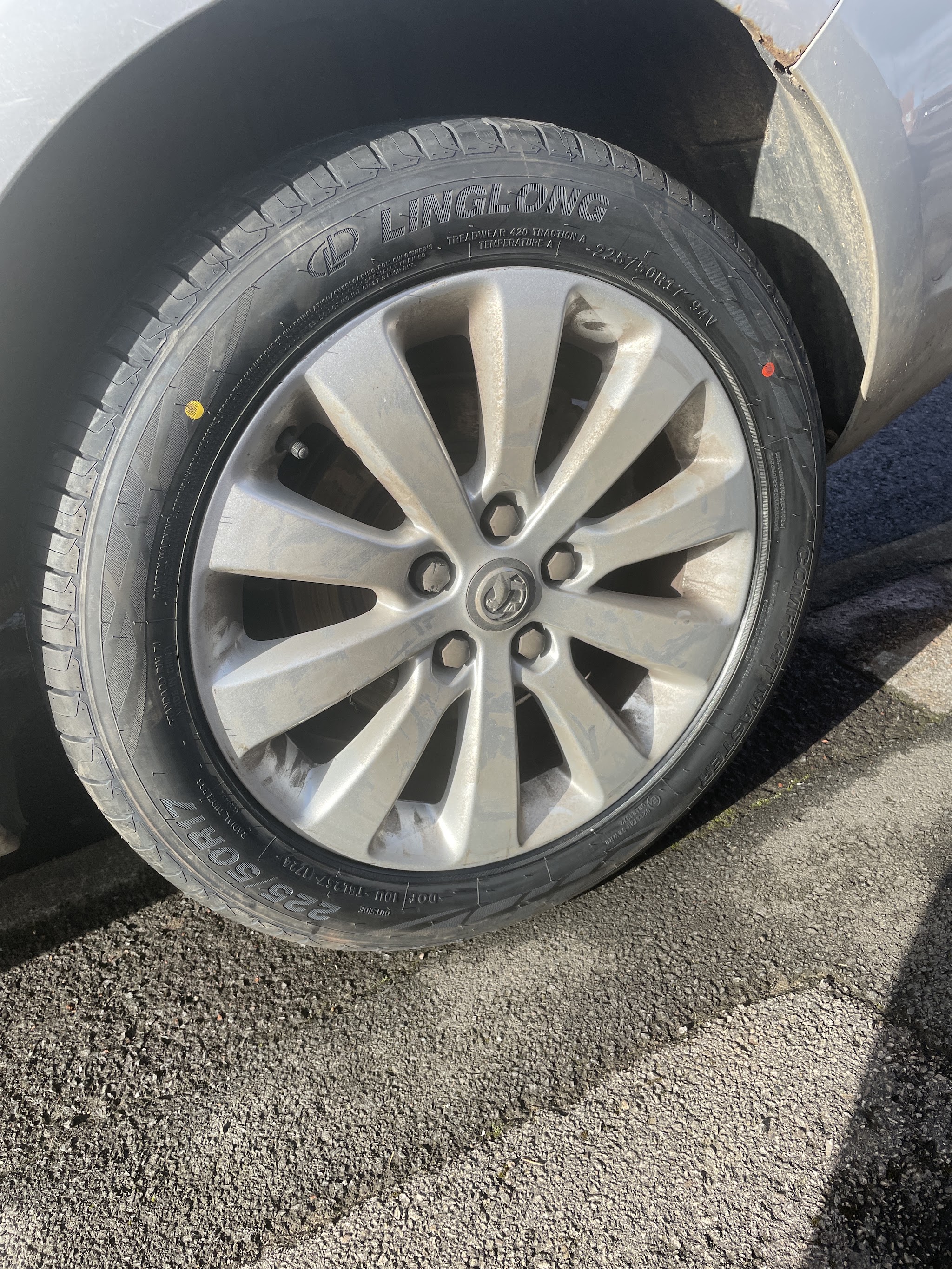 A brand new tyre freshly fitted to a silver alloy wheel